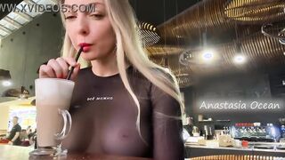 Public - Sexy blonde flashes her big natural tits in a crowded cafe.